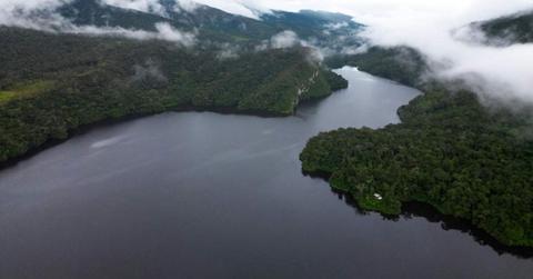 The mighty Amazon River is surrounded by thick vegetation and misty mountains. (Representative Cover Image Source: Pexels | Edwin Malca Cerna)