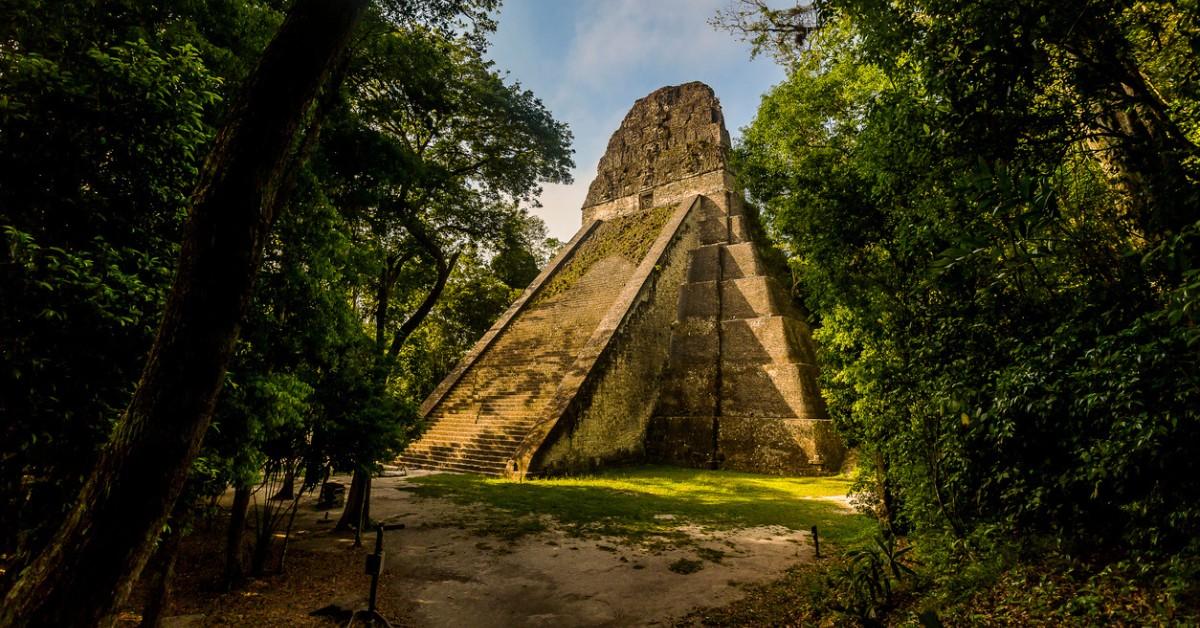 A Maya pyramid and temple stands in the jungle of Guatemala 