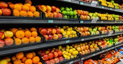 Produce sits on the shelves in a grocery store