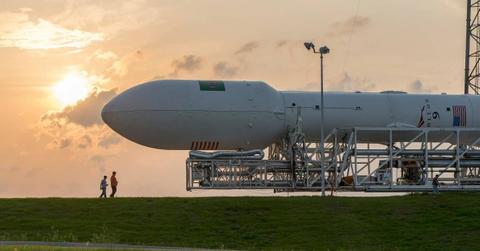 Two people walk past a spacecraft. (Representative Cover Image Source: Pexels | SpaceX)