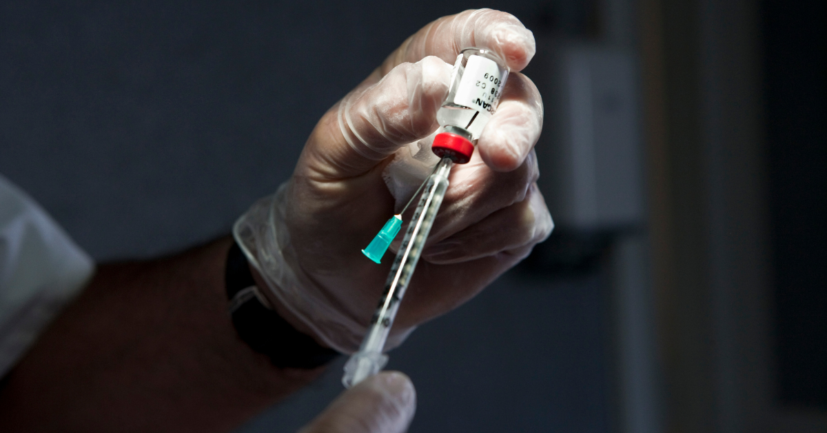 Medical professional prepping a needle for a Botox injection