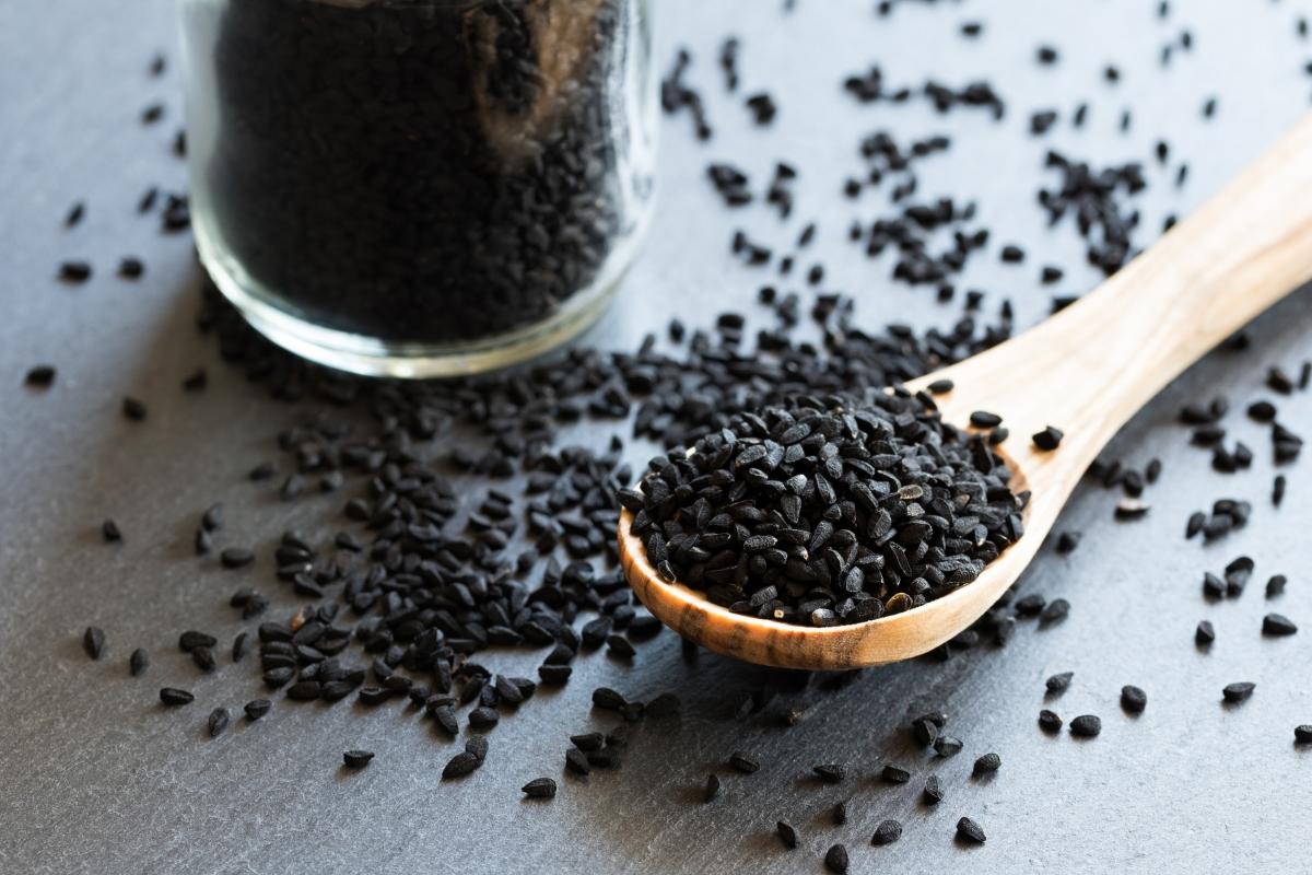 bowl and spoonful of black cumin seeds