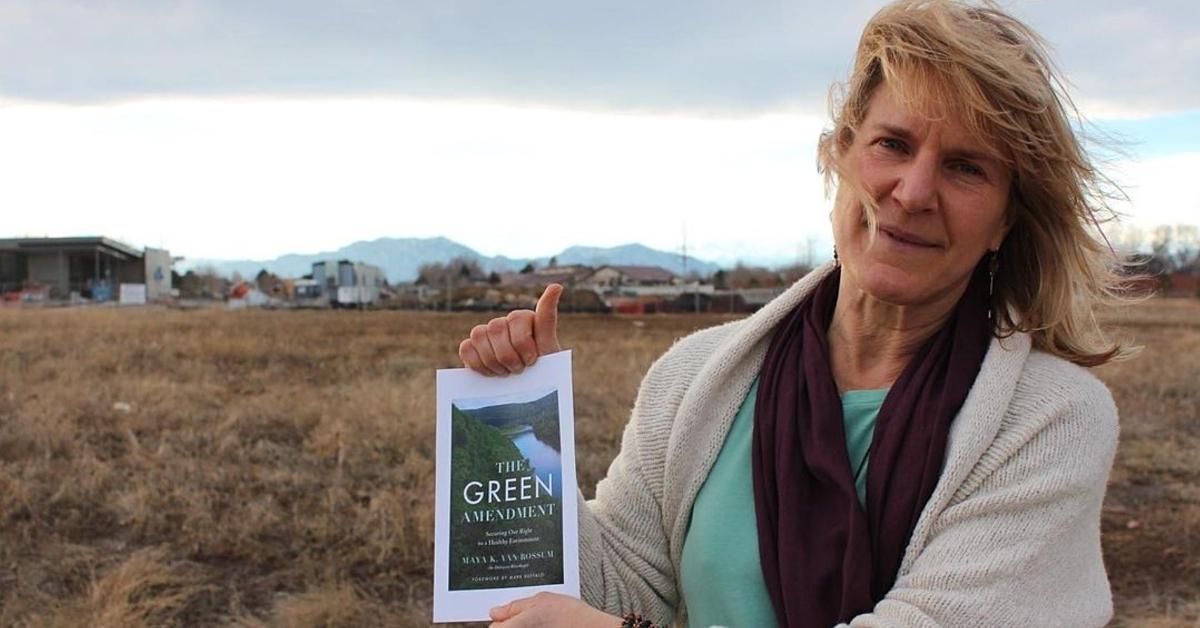 Delaware Riverkeeper Maya K. van Rossum holds up her book 'The Green Amendment'