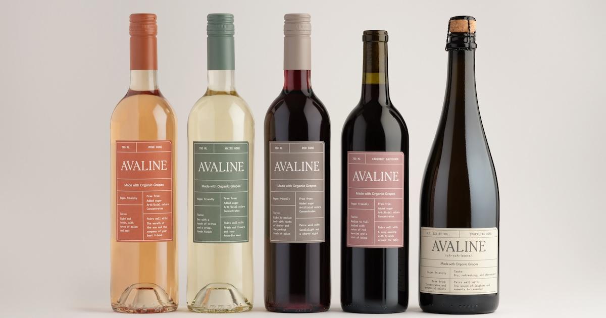 Five bottles of Avaline wine on a grey background