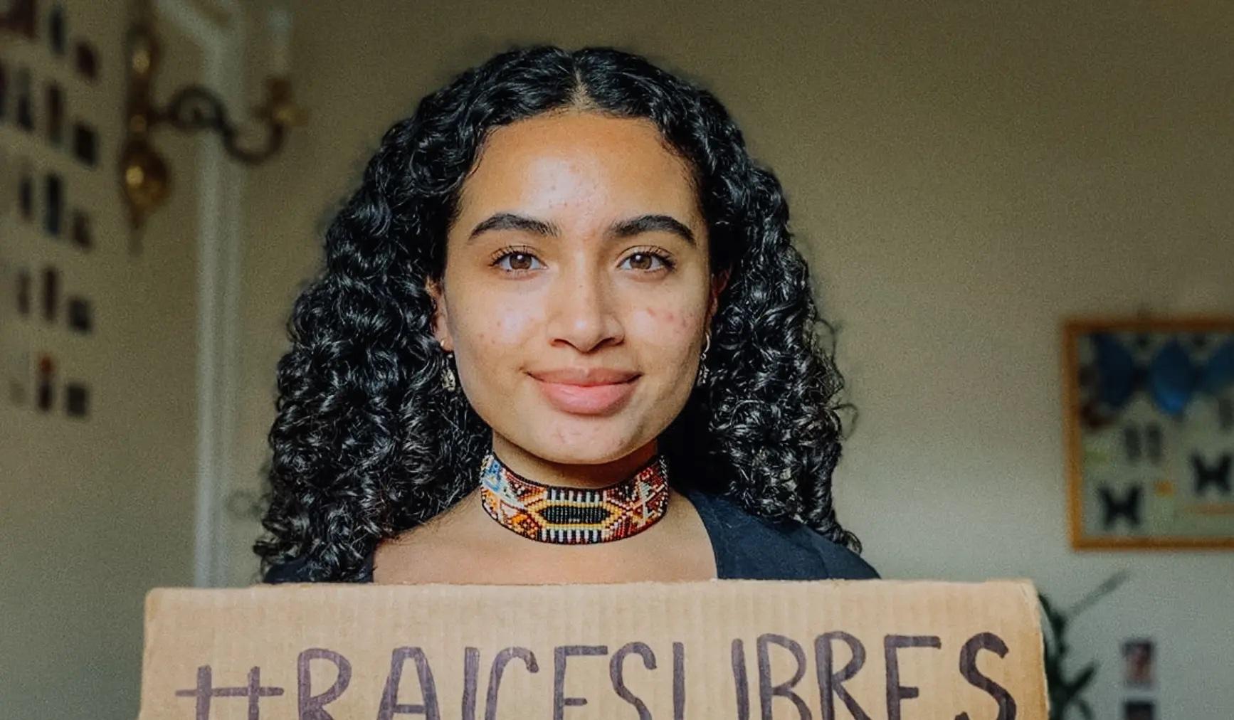 Keyra Juliana Espinoza holds a sign