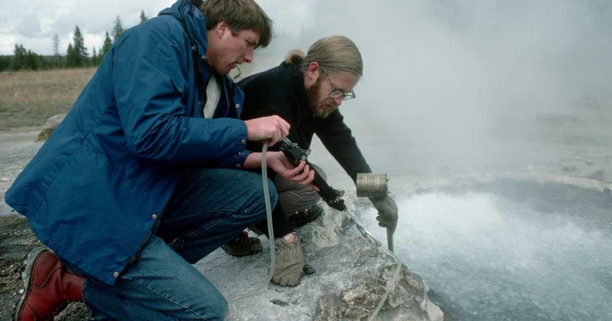 Two scientists are examining a hot spring in Yellowstone National Park. (Representative Cover Image Source: Getty Images | James L Amos)