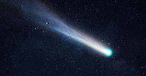 Comet glowing with blue and green colors flitting through the starry space (Representative Cover Image Source: Getty Images | Alones Creative)