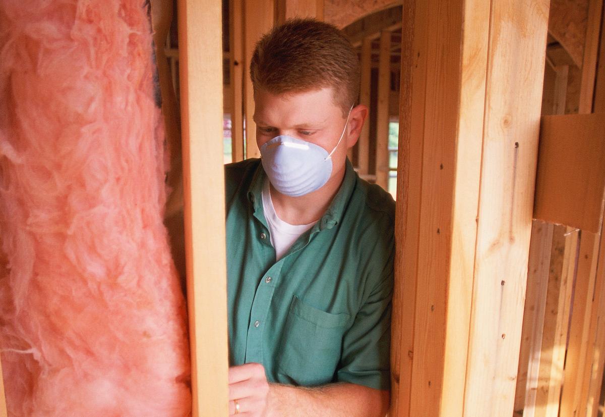 Man inspecting insulation