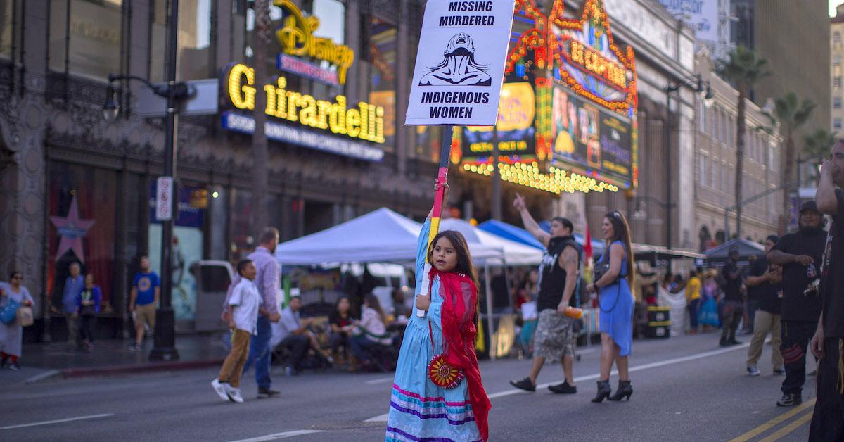 Young girl protests for Indigenous Peoples' Day