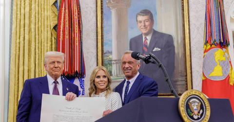 U.S. President Donald Trump, left, displays a document confirming Robert F. Kennedy Jr., right, as the Secretary of Health and Human Services.