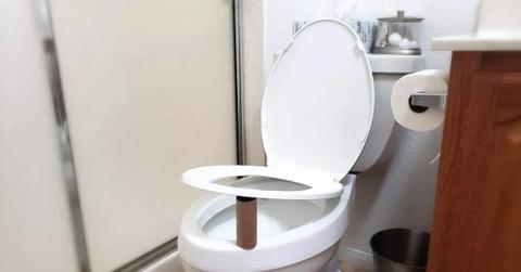 Toilet paper roll under seat