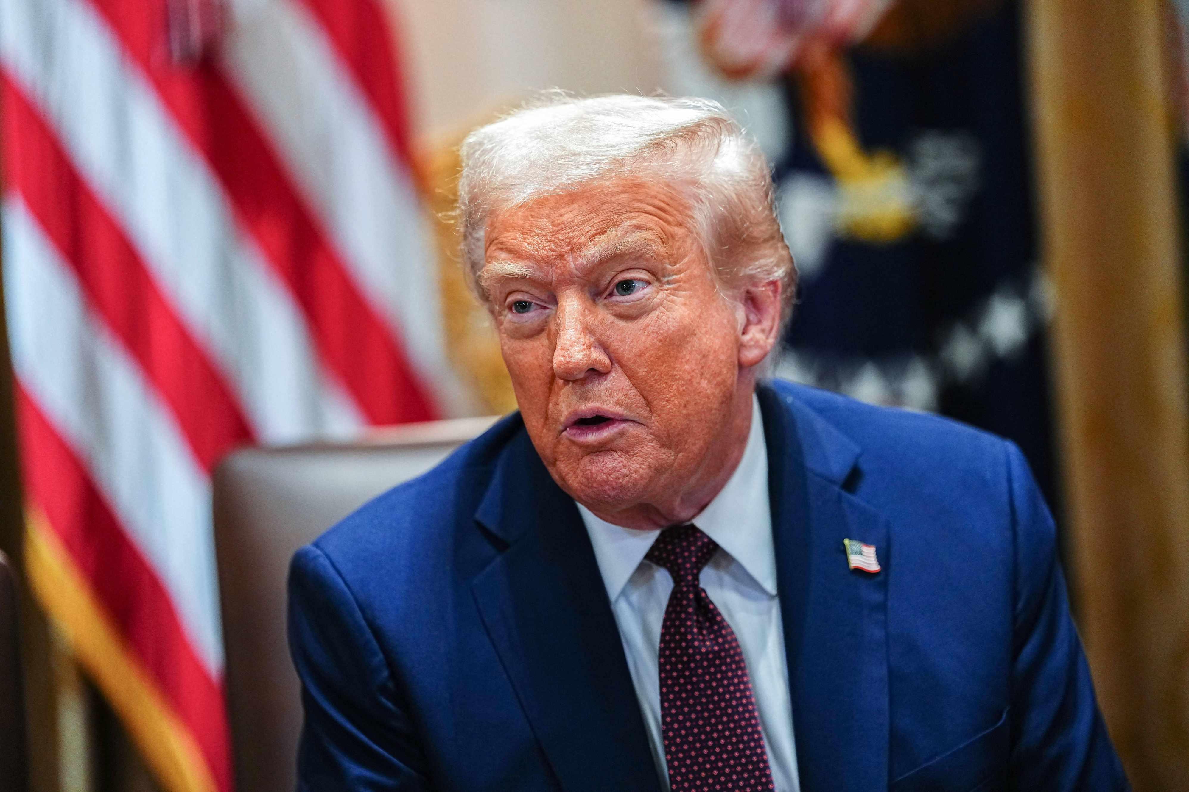 President Donald Trump speaks at a Cabinet Meeting in the White House on August 26.