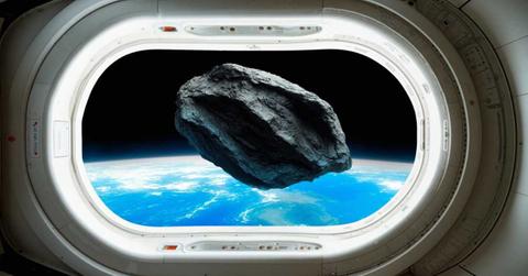 A space rock visible from a NASA satellite hovering around planet Earth. (Representative Cover Image Source: Getty Images | VICTOR HABBICK VISIONS/SCIENCE PHOTO LIBRARY)