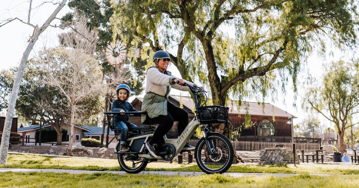 Mother and child ride Aventon e-bike in park