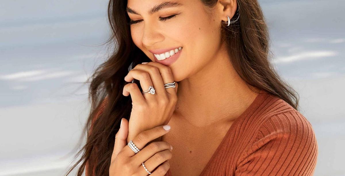 woman with long hair and diamond jewelry