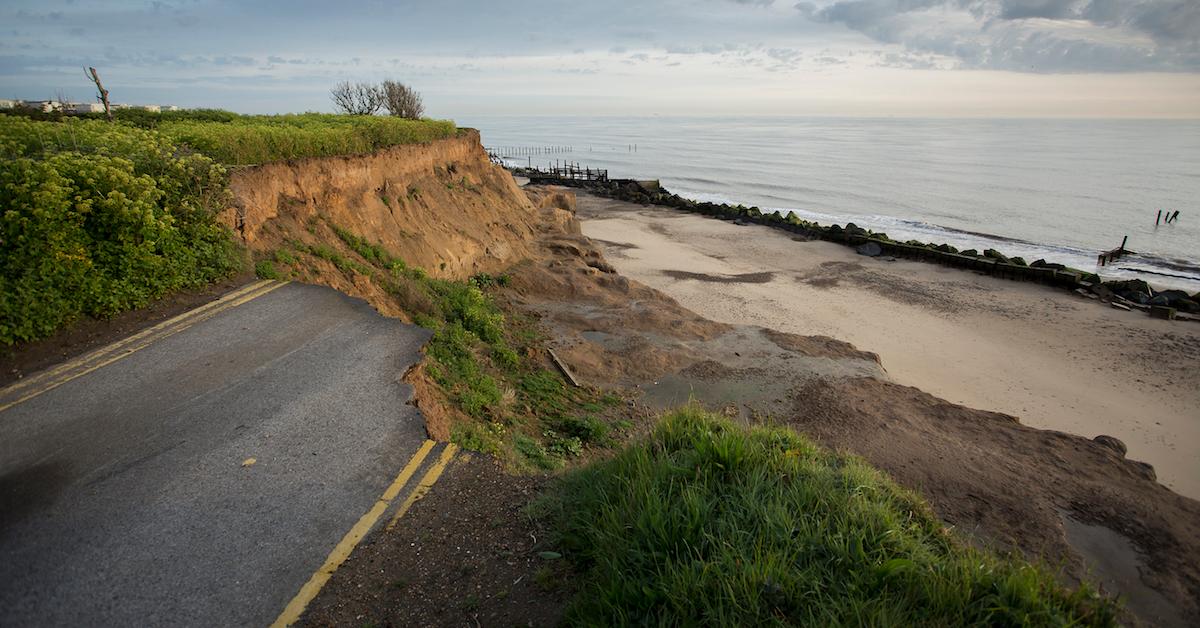 Photograph of coastal cliffside with beach.