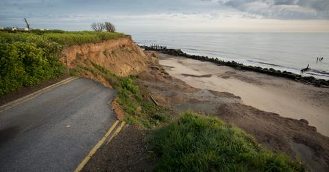 Photograph of coastal cliffside with beach.