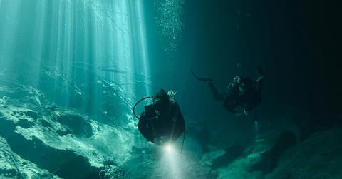 Divers exploring the sea floor. (Representative Cover Image Source: Pexels | Francisco Davids)