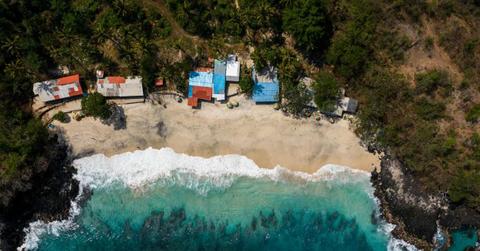 Buildings near the ocean. (Representative Cover Image Source: Pexels | Photo by Mikhail Nilov)