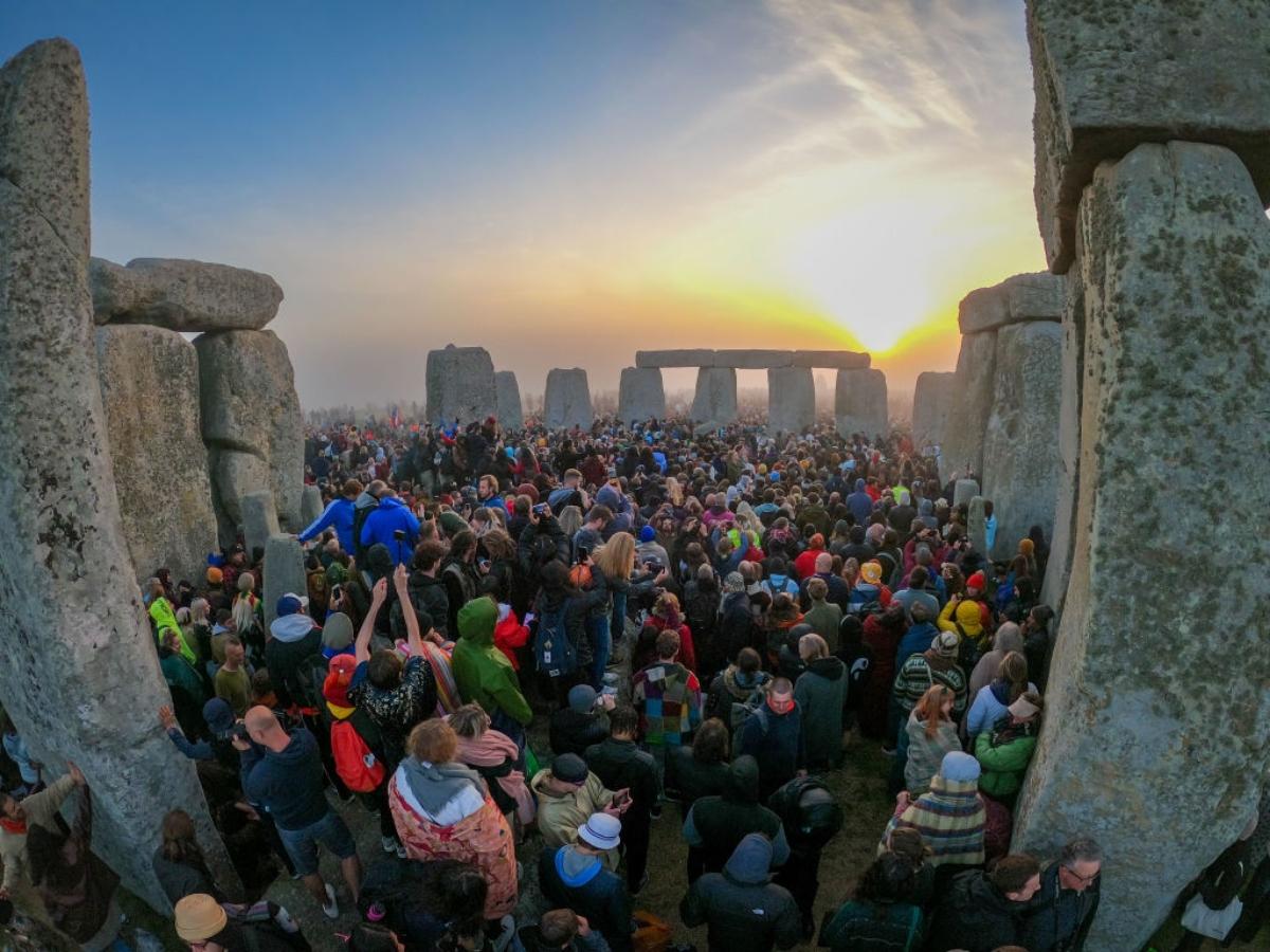 Crowds at Stonehenge at sunrise on summer solstice.