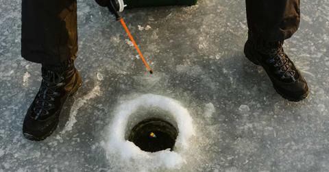 Researcher drops an ice block inside a deep borehole in Antarctic ice (Representative Cover Image Source: Pexels | Tima Miroshnichenko)
