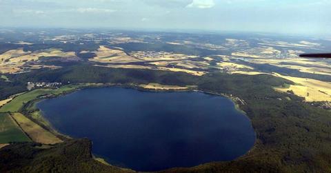 Laacher See, also known as Lake Laach or Laach Lake, seen from the east, located in Germany. (Cover Image Source: Wikimedia Commons | Df1paw)
