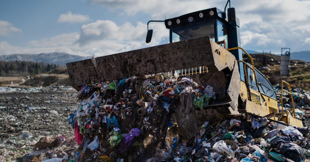 Truck unloading waste in landfill