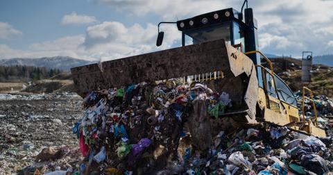 Truck unloading waste in landfill