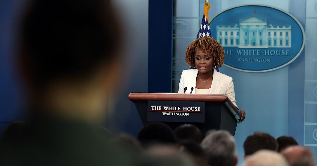 White House Press Secretary Karine Jean-Pierre at a White House podium.