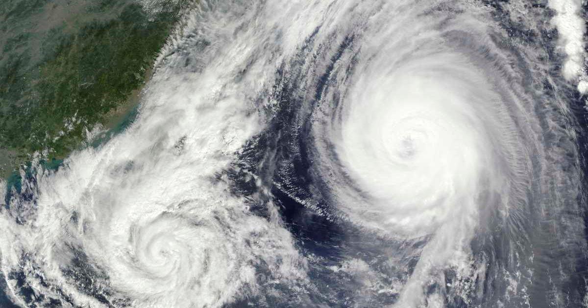 Two tropical storms spinning in an orbit (Representative Cover Image Source: Getty Images | Stocktrek Images)