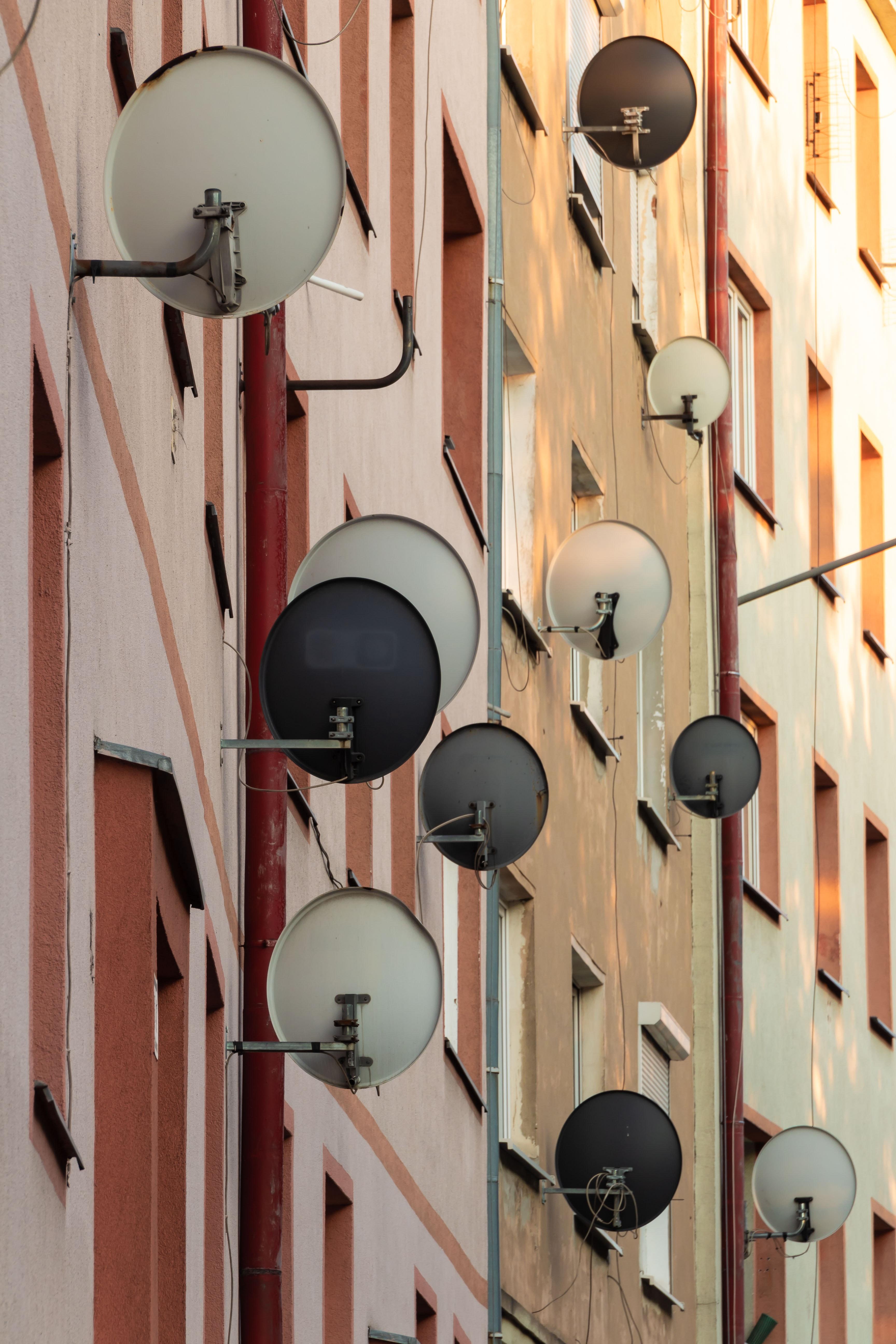 Satellite dishes on multiple buildings