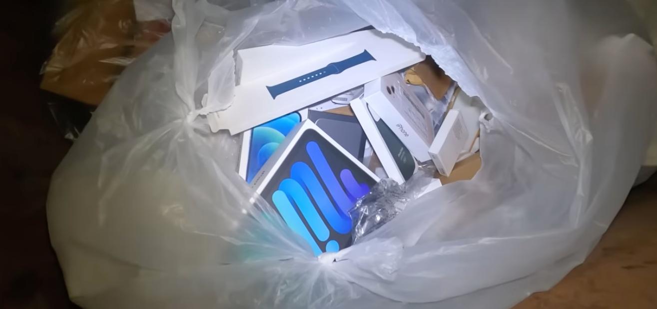 Apple Products and Packaging in a Dumpster