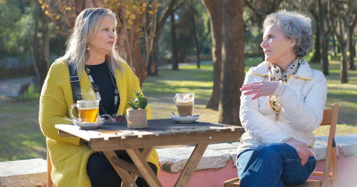 Two elderly women talking to each other while having tea (Representative Cover Image Source: Pexels | Photo by Kampus Production)