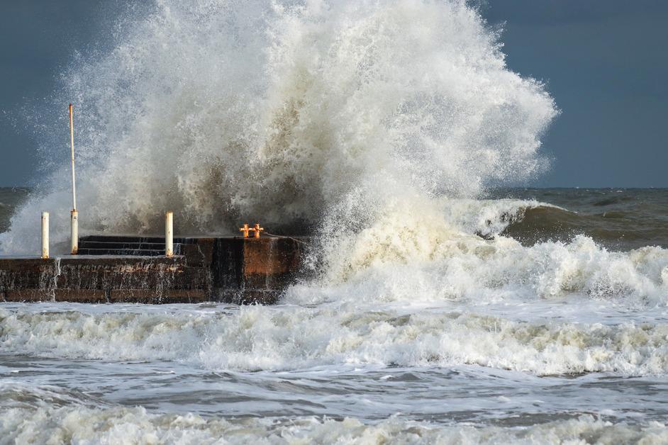 Water spilling over wall