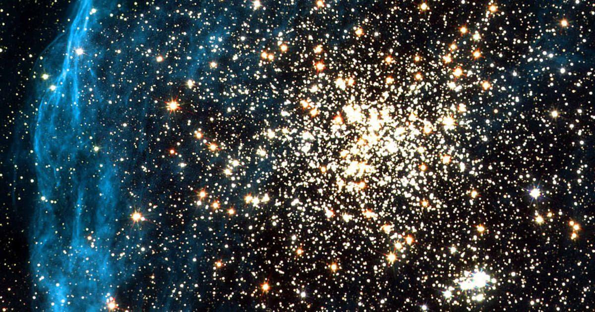 Galaxy cluster glittering with zillions of golden diamond-like stars enguled in a shimmery blue halo (Representative Cover Image Source: Getty Images | NASA)