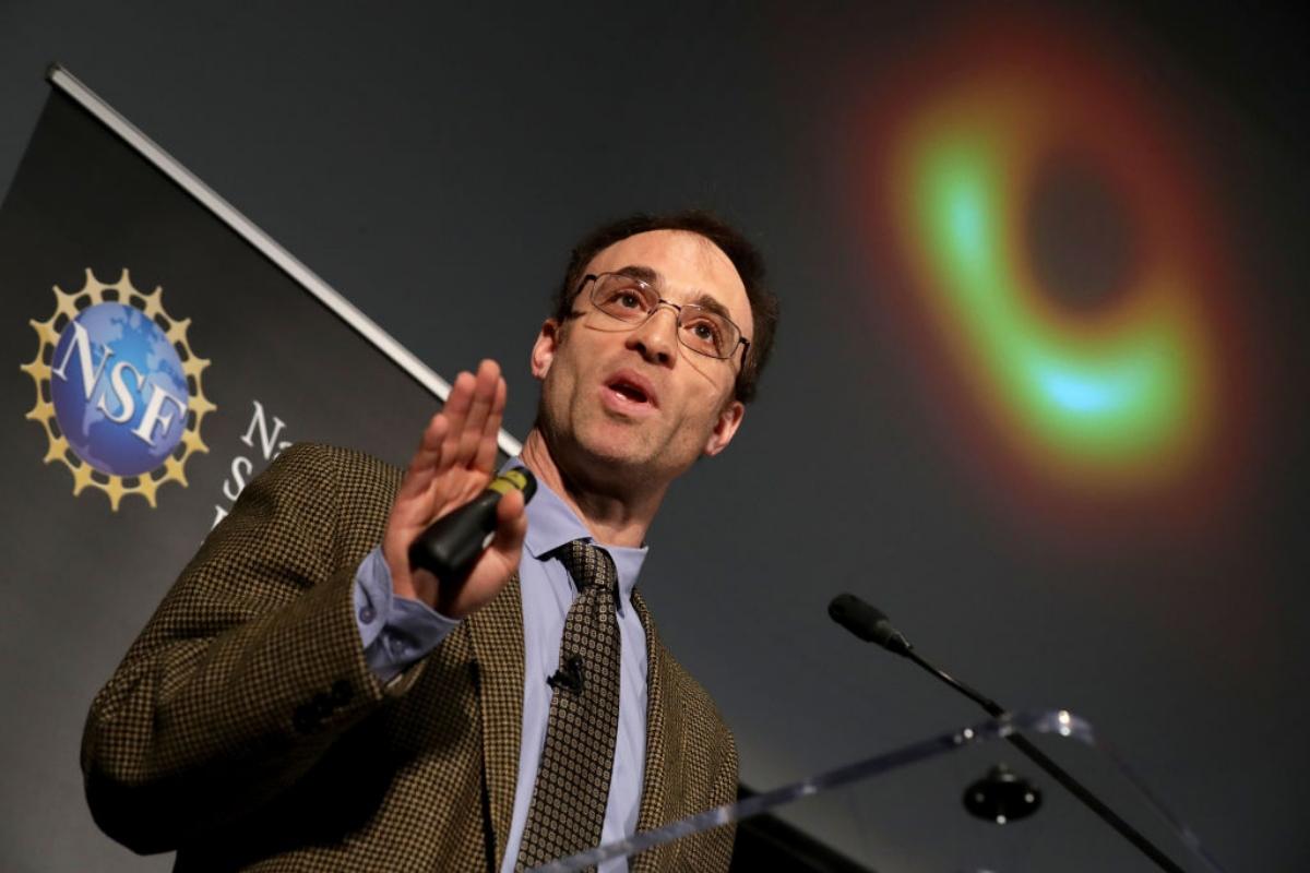 male speaker introducing first image of a black hole 