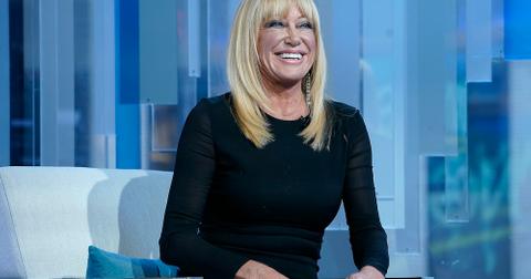 Suzanne Somers smiling on couch
