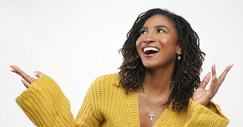 Headshot of holistic health coach and celebrity yoga instructor Koya Webb in front of a white background
