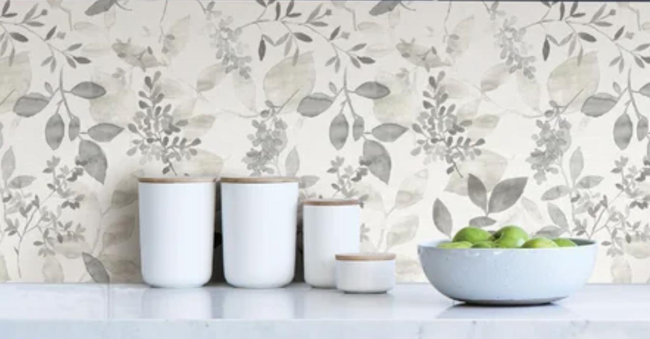 A floral wallpaper used as a backsplash in a kitchen. 