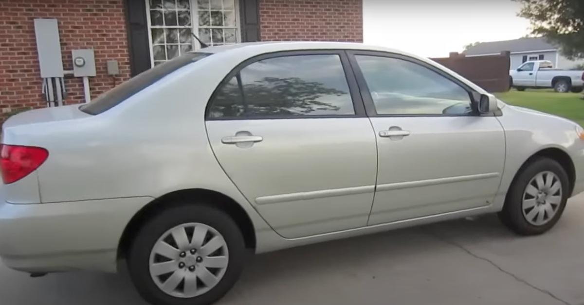 A silver 2003 Toyota Corolla. 