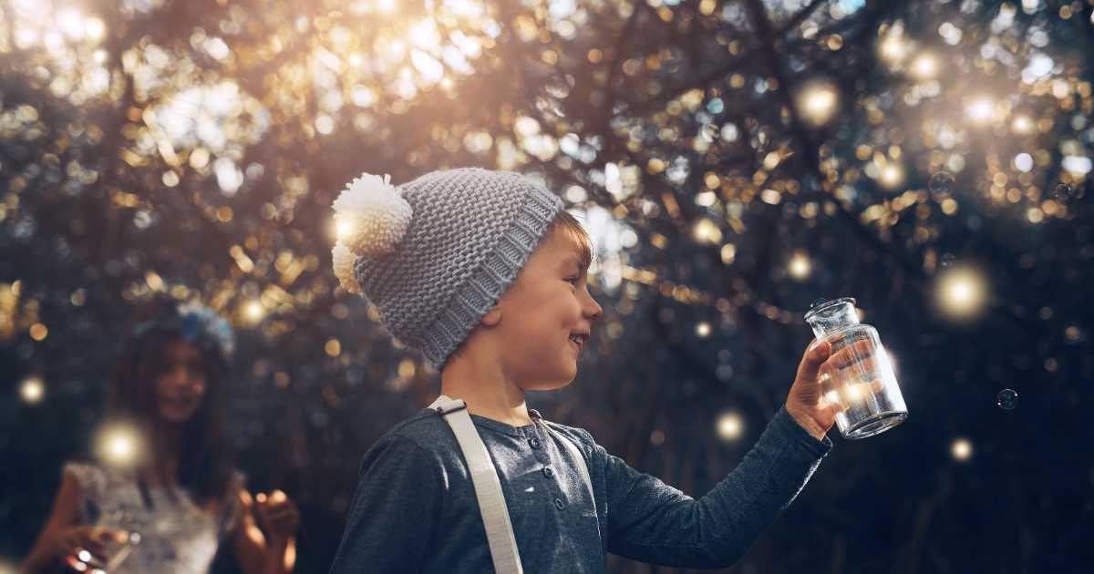 Two kids are catching fireflies in a jar in the garden. (Representative Cover Image Source: Getty Images | Jacob Wackerhausen)