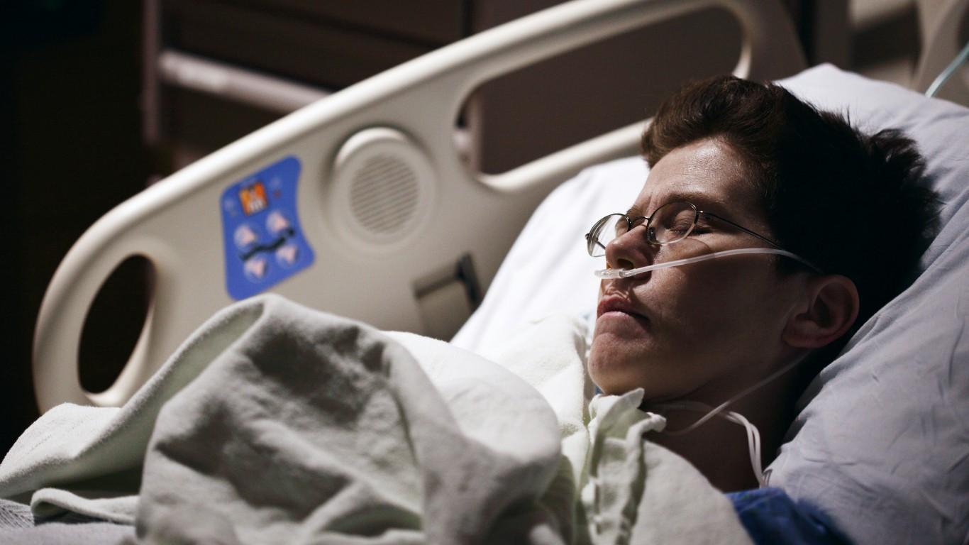 A man lays in a hospital bed