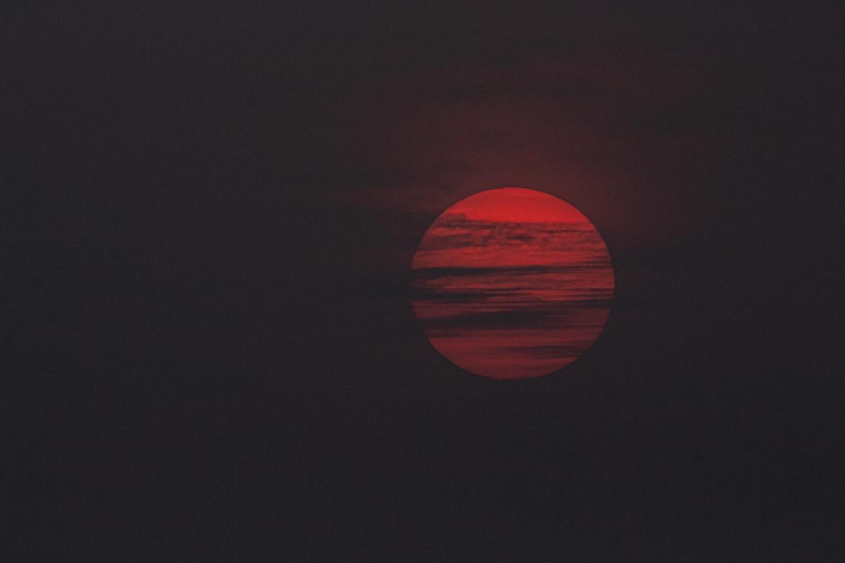 Red sun in a dark sky