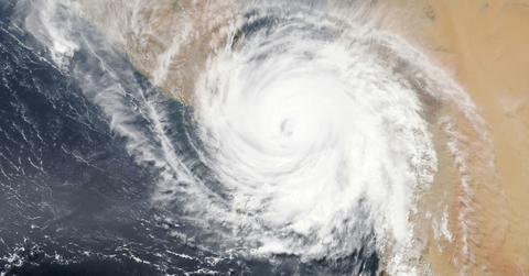 Satellite view of a hurricane system over land and water