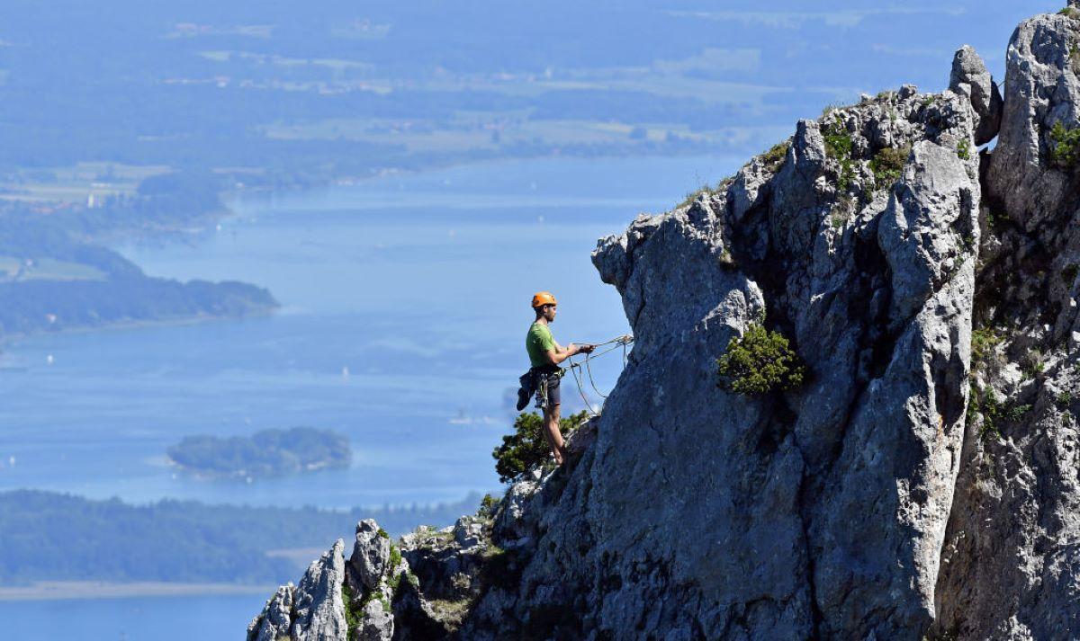 Man climbing up a mountain