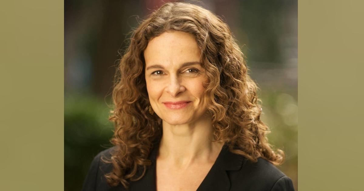 Headshot of Rabbi Jennie Rosenn, the founder and CEO of Dayenu, on green background