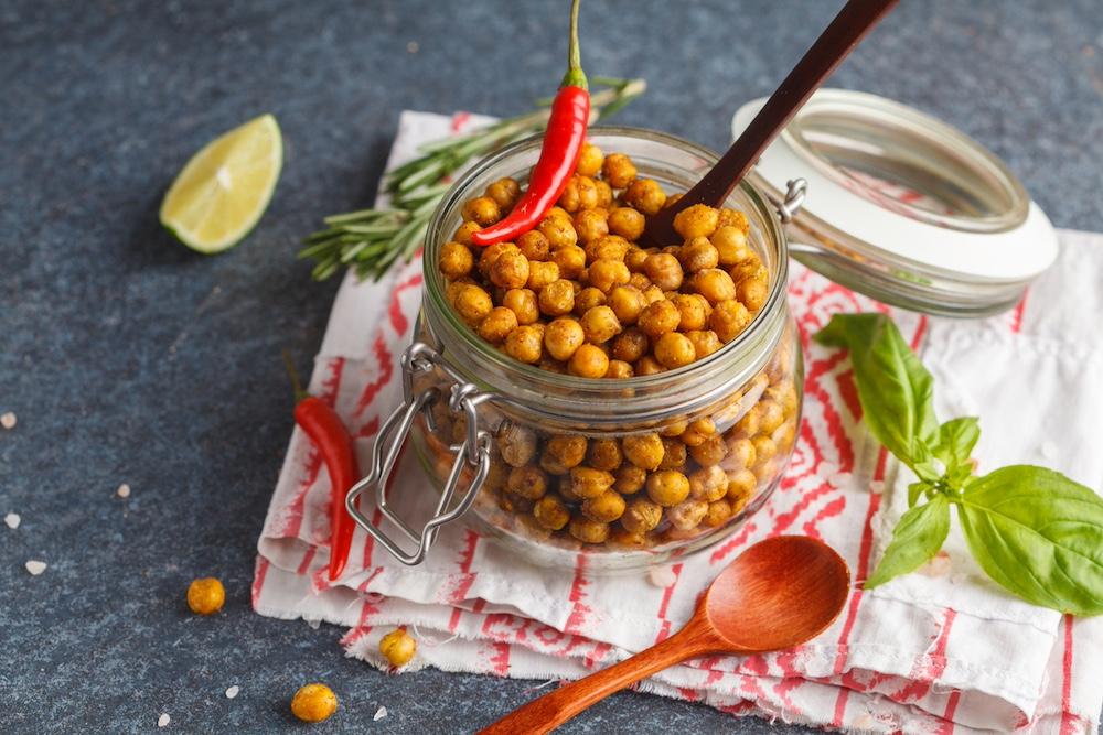 Spicy chickpeas in a glass jar. 