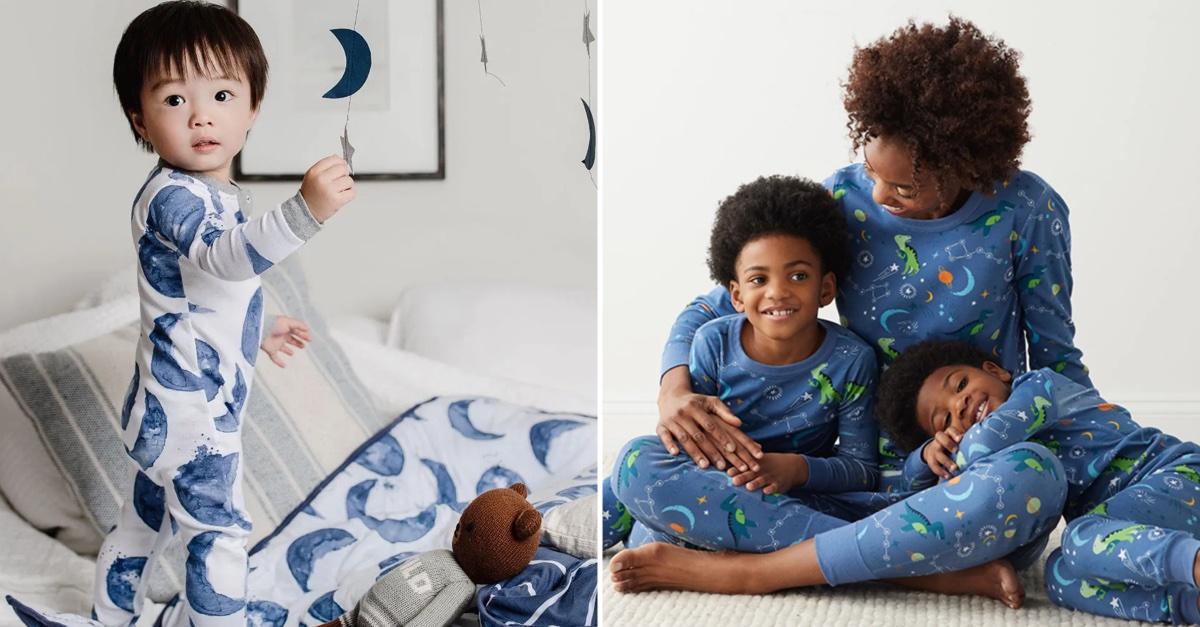 A toddler stands in a blue and white onesie; a family of three in matching blue pajamas