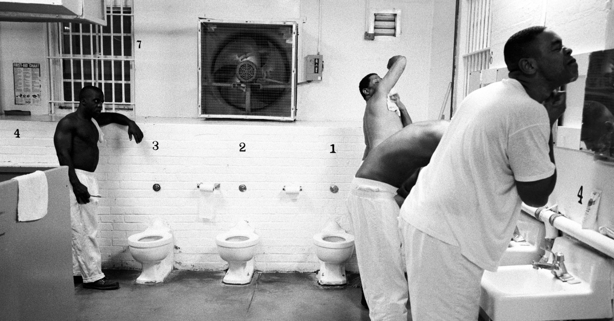 Men in a Houston, Texas prison wash up using the facility's water