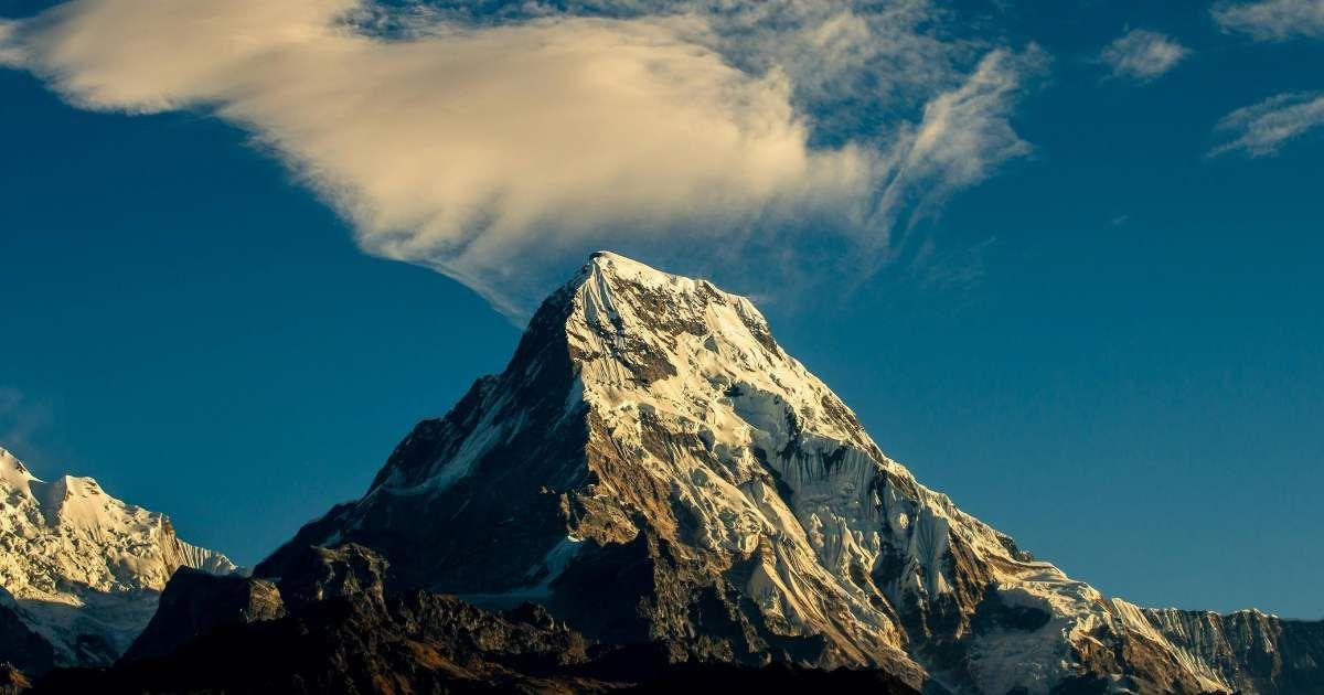 A snow-covered mountain peak reaching upto the clouds. (Representative Cover Image Source: Pexels Pixabay)